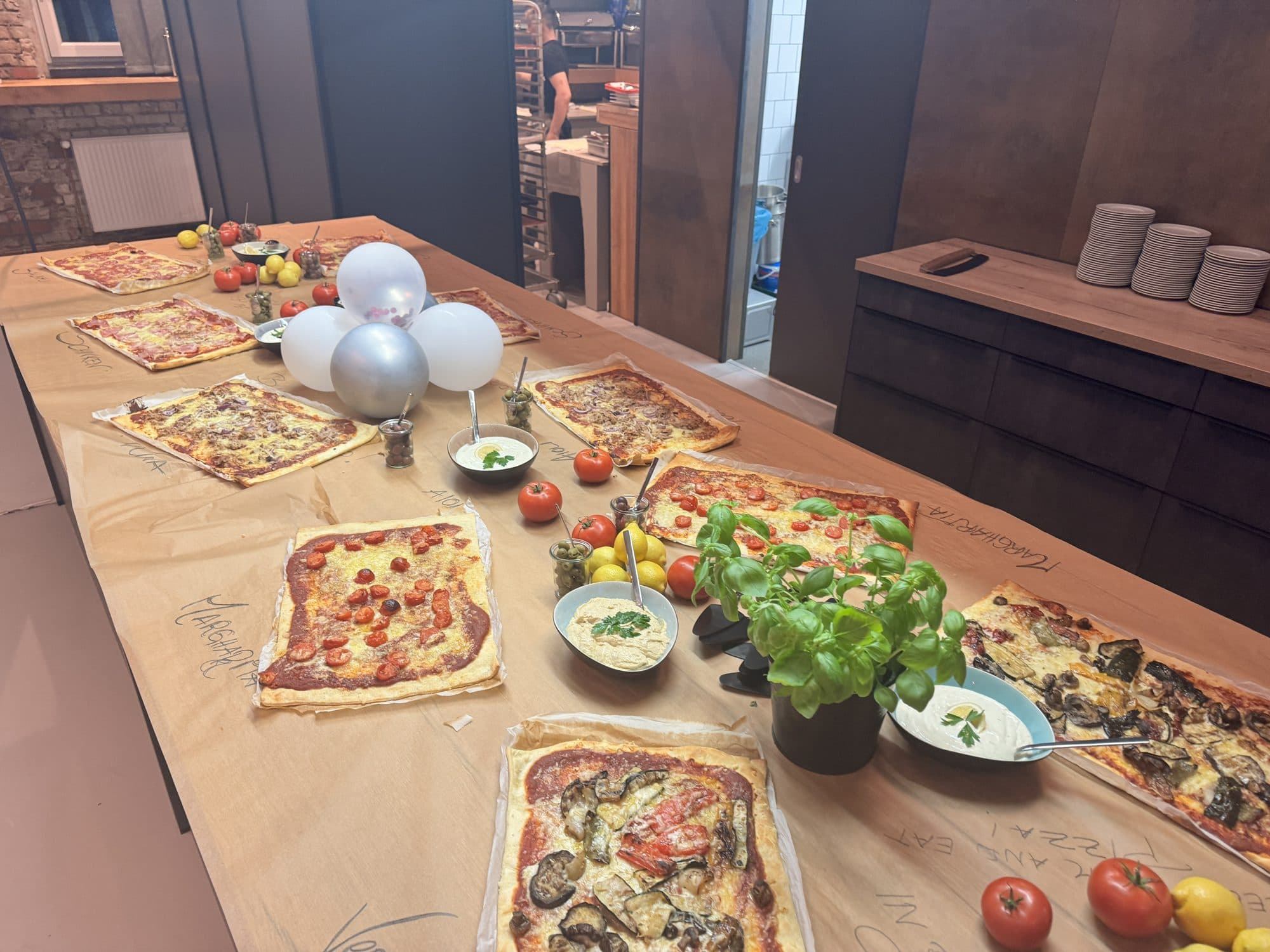 Tarte flambée fresh from the kitchen on the table at the REST2RENT event venue in Hamburg