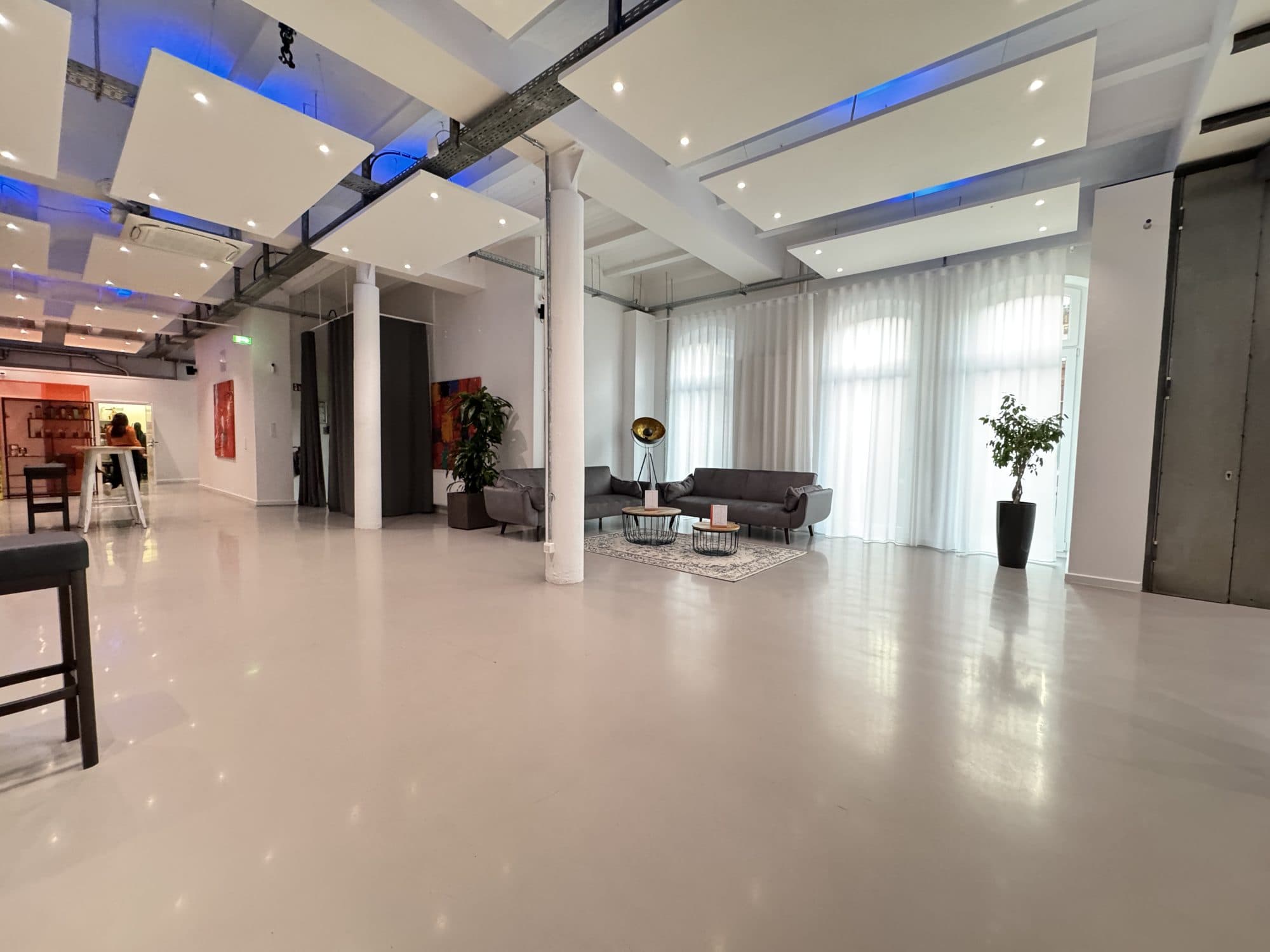 Empty event space with lounge furniture at the REST2RENT event venue in Hamburg